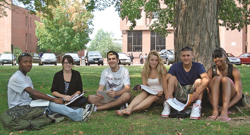 Image of students sitting on STCC campus green