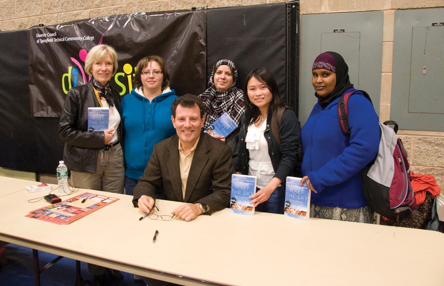 ESL students and Professor Jill Mendez pose with author Nicholas Kristof.