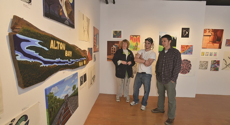 Image of professor and students in art gallery
